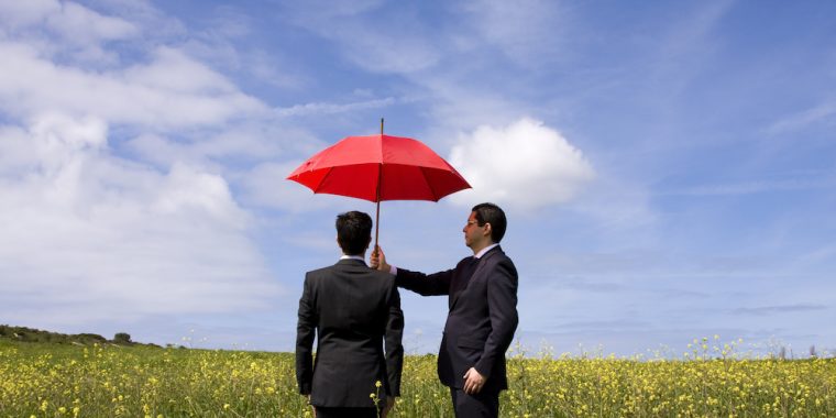 business man holding umbrella Marshfield MO